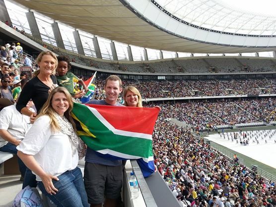 AWOL Tours team with South African flag at Nelson Mandela memorial